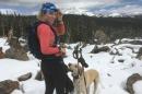 主要研究 student Georgi Fischer cross country skiing with her dog
